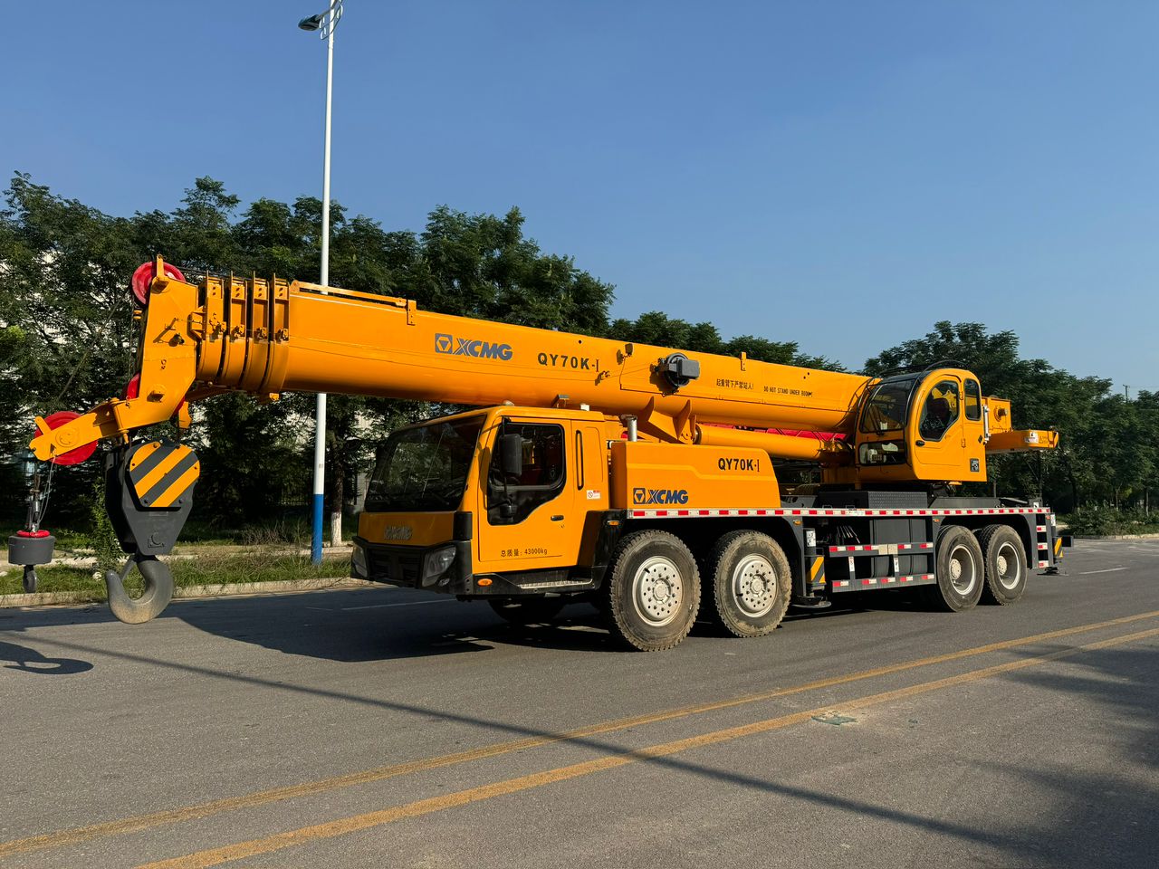 MGE truck mounted crane with telescopic boom stowed ready to travel to site