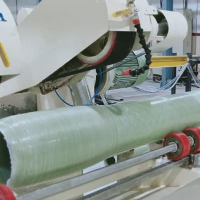 A roller being ground to size after covering at MGE Trading and Services